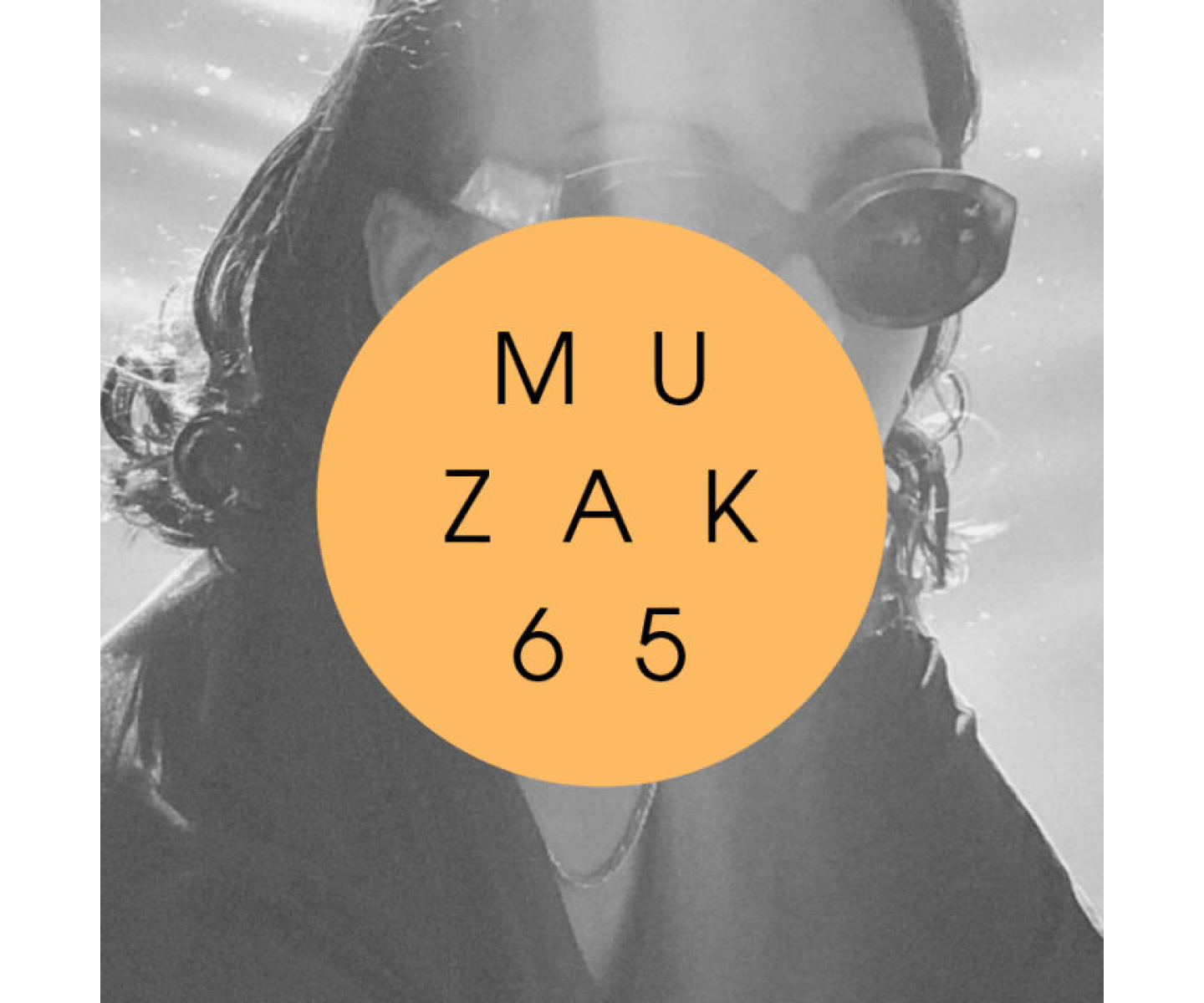 The image shows a person wearing sunglasses, with light reflecting off the background. A large orange circle with the text "MUZAK 65" is placed over the center of the image. The picture is in black and white except for the orange circle.